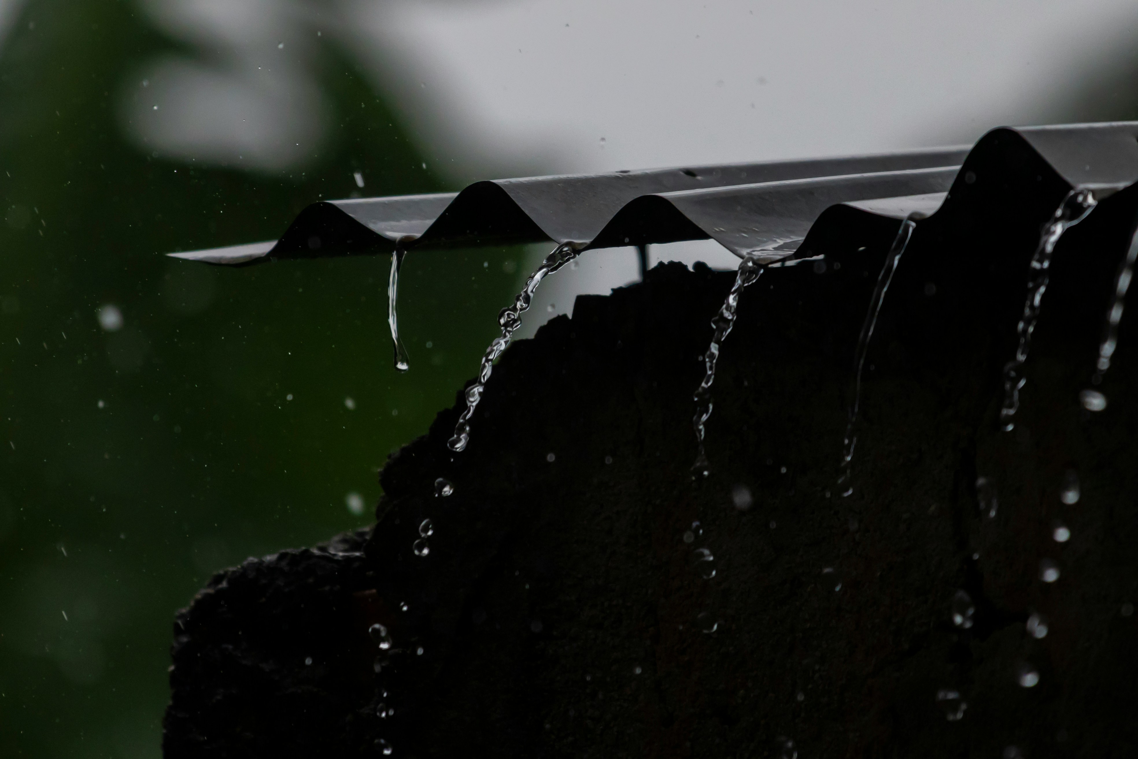Heavy rain bouncing off a roof